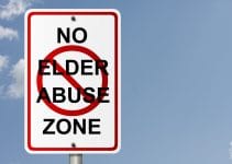 Road sign with no elder abuse zone written on it